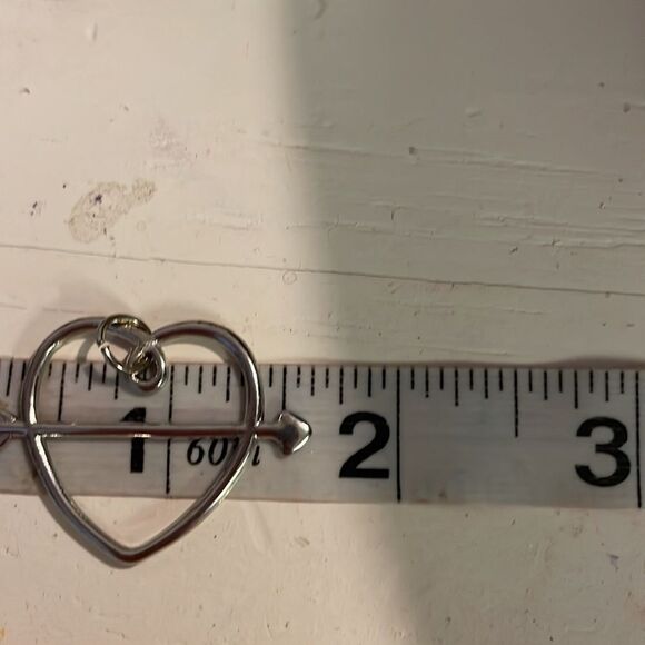 1” x 1.5” reversible silver tone open heart with arrow pendant with jump hoop - Picture 10 of 12